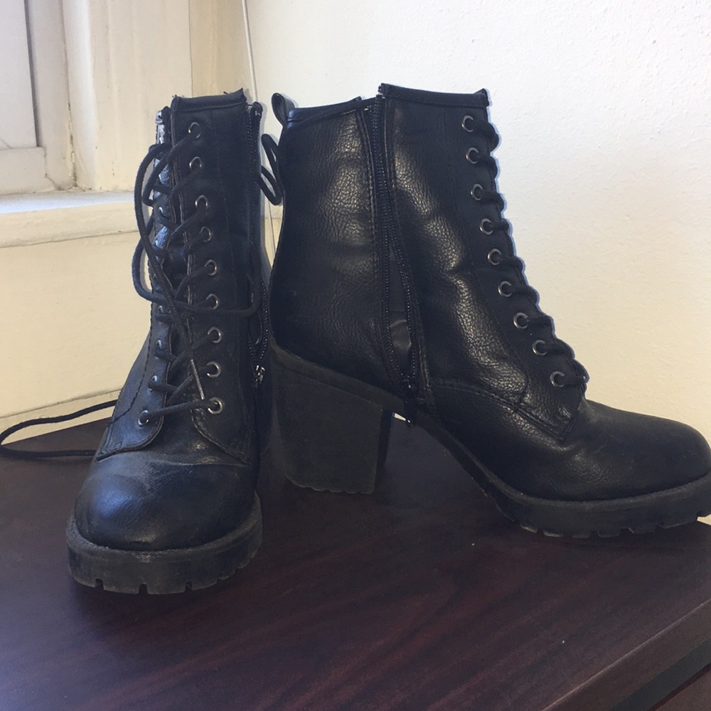 Zip up black heeled combat boots